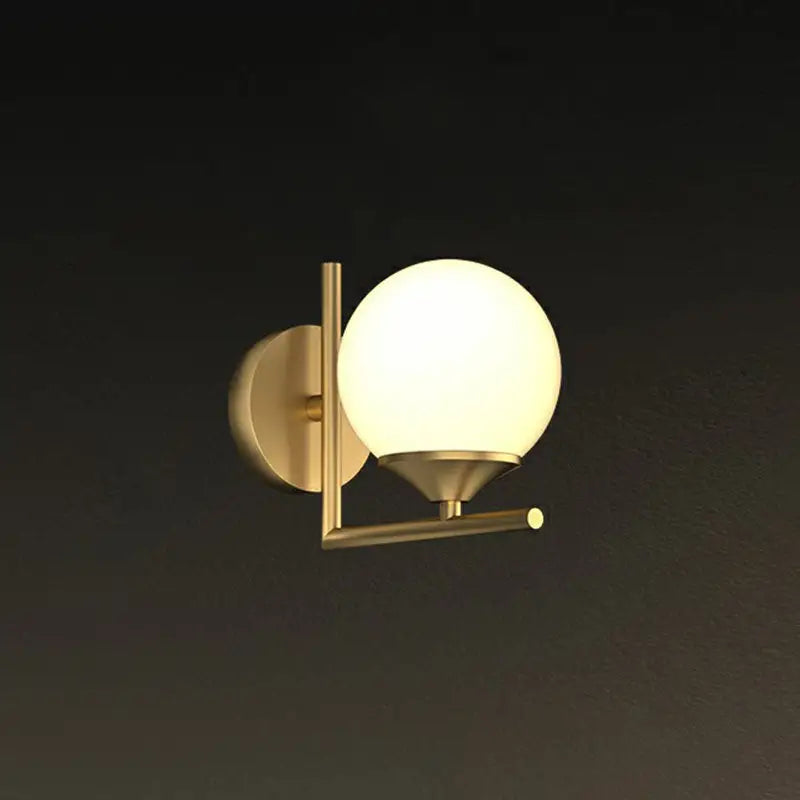Minimalist brass wall lamp with frosted glass globe and geometric metal frame led wall lamp for dining room