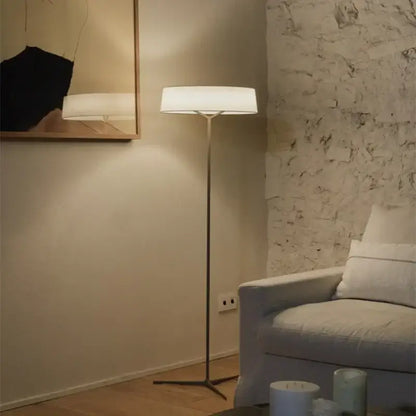 A minimalist dama pendant lamp with a white fabric shade and brass stand ideal for kitchen lighting