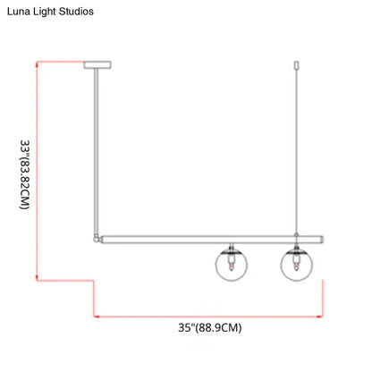 Modern minimalist ceiling light with white glass globe shades and brass frame for kitchen island by luna light studios