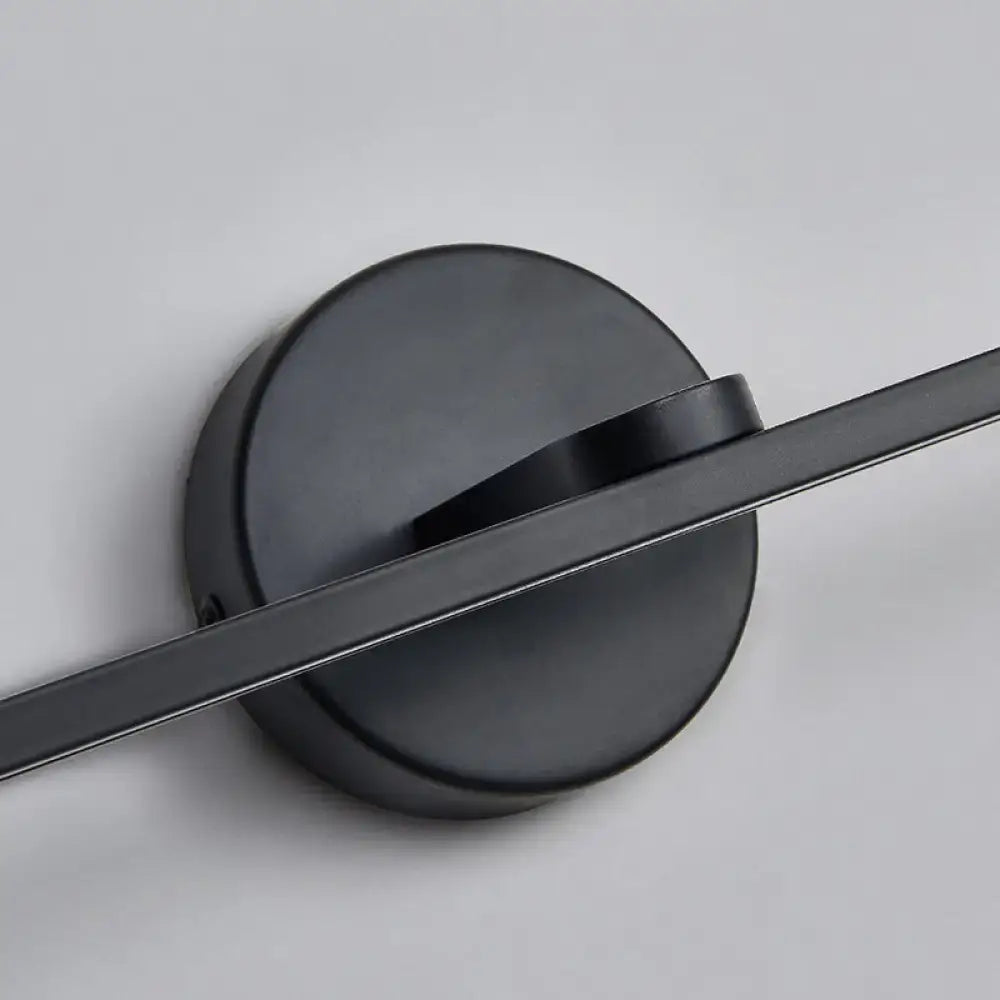 Minimalist black matte wall light with brass elliptical design for bathroom sconce fixture and modern decor