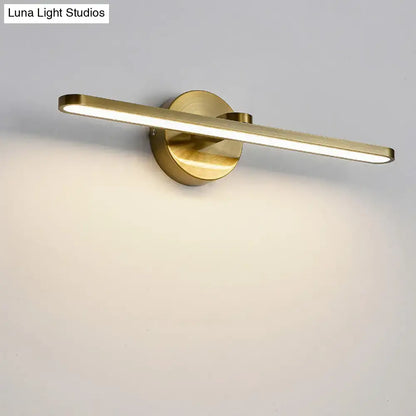 Minimalist brass elliptical wall light with gold finish featuring a sleek rectangular light bar for bathroom use