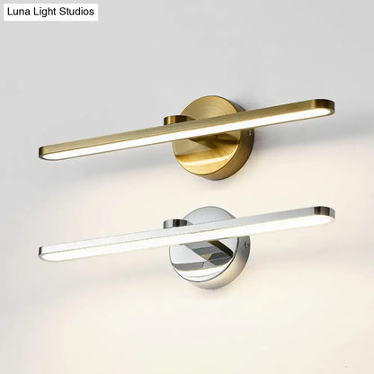 Minimalist brass elliptical wall light featuring a sleek elongated led light bar on a circular base for bathroom use