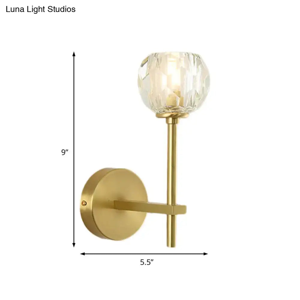 Minimalist brass gold-toned wall sconce with faceted crystal globe shade in two sizes direct wired bedroom light