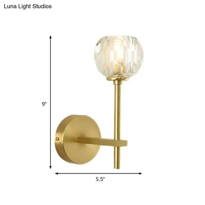 Minimalist brass gold-toned wall sconce with faceted crystal globe shade in two sizes direct wired bedroom light