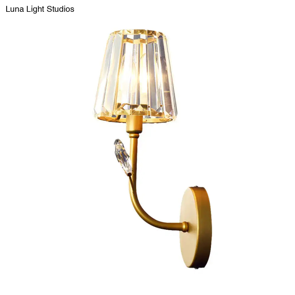 Minimalist brass finish wall sconce with gold-toned crystal lampshade and ornamental crystal accent wall light