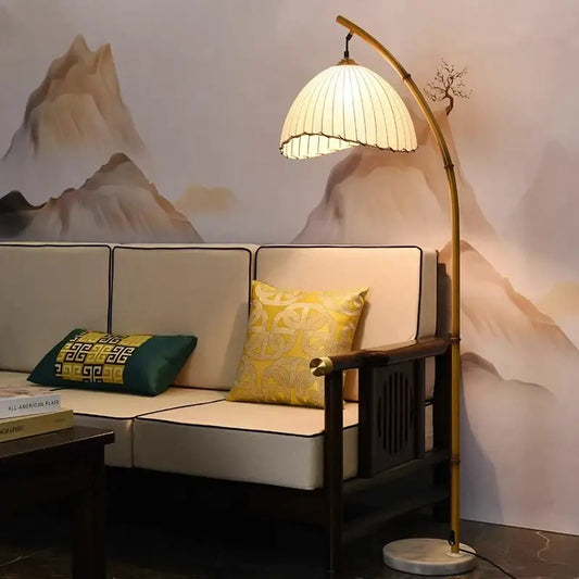 Minimalist curved brass led floor lamp with pleated off-white shade and marble base for living room lighting