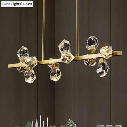 Gold-toned minimalist brass led gemstone dining room ceiling light with faceted crystal droplets on a sleek bar