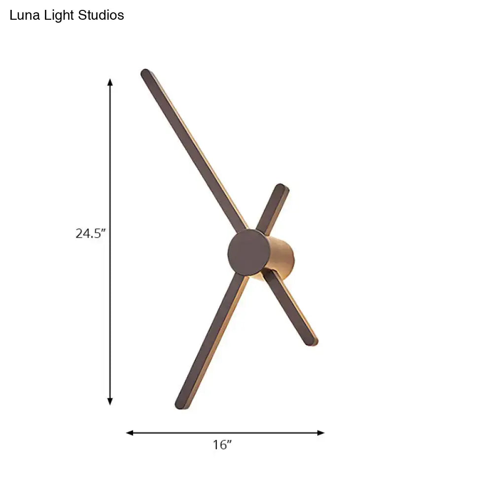 Modern minimalist wall light sconce clock with slender matte bronze arms and cylindrical base for living room lighting
