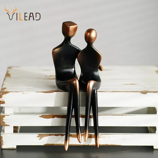 Minimalist bronze and black resin couple sculptures with smooth stylized forms for elegant resin decorbites bedroom decor