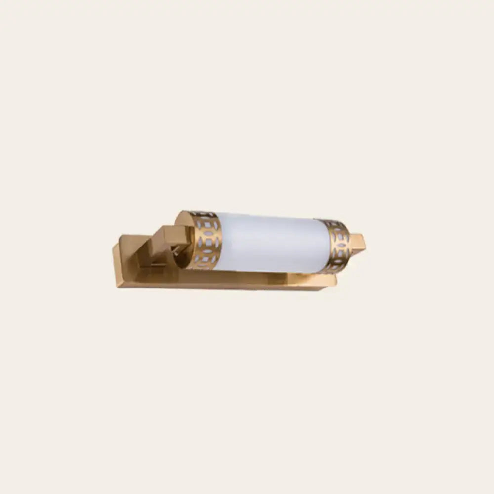 Gold-finished wall light sconce with frosted glass cylinder and bronze greek key metal bands for bathroom vanity