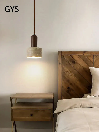 Minimalist pendant lamp with a matte brown cylindrical top and cream wind led concrete shade for dining room decorbites cream wind