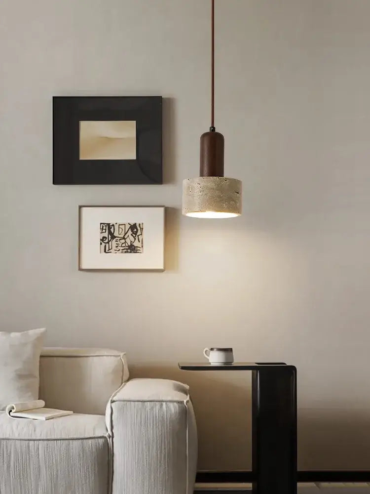 Minimalist brown and cream pendant lamp with a dark cylindrical top and textured concrete cream wind led shade