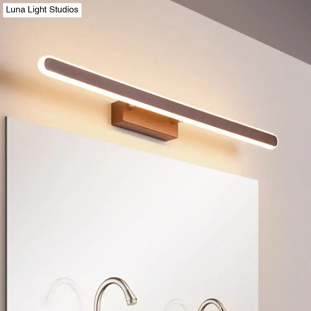 Minimalist brown led vanity wall light with warm glow, sleek metallic finish, and wooden base for bathroom use