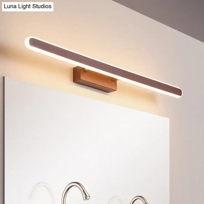 Minimalist brown led vanity wall light with warm glow, sleek metallic finish, and wooden base for bathroom use