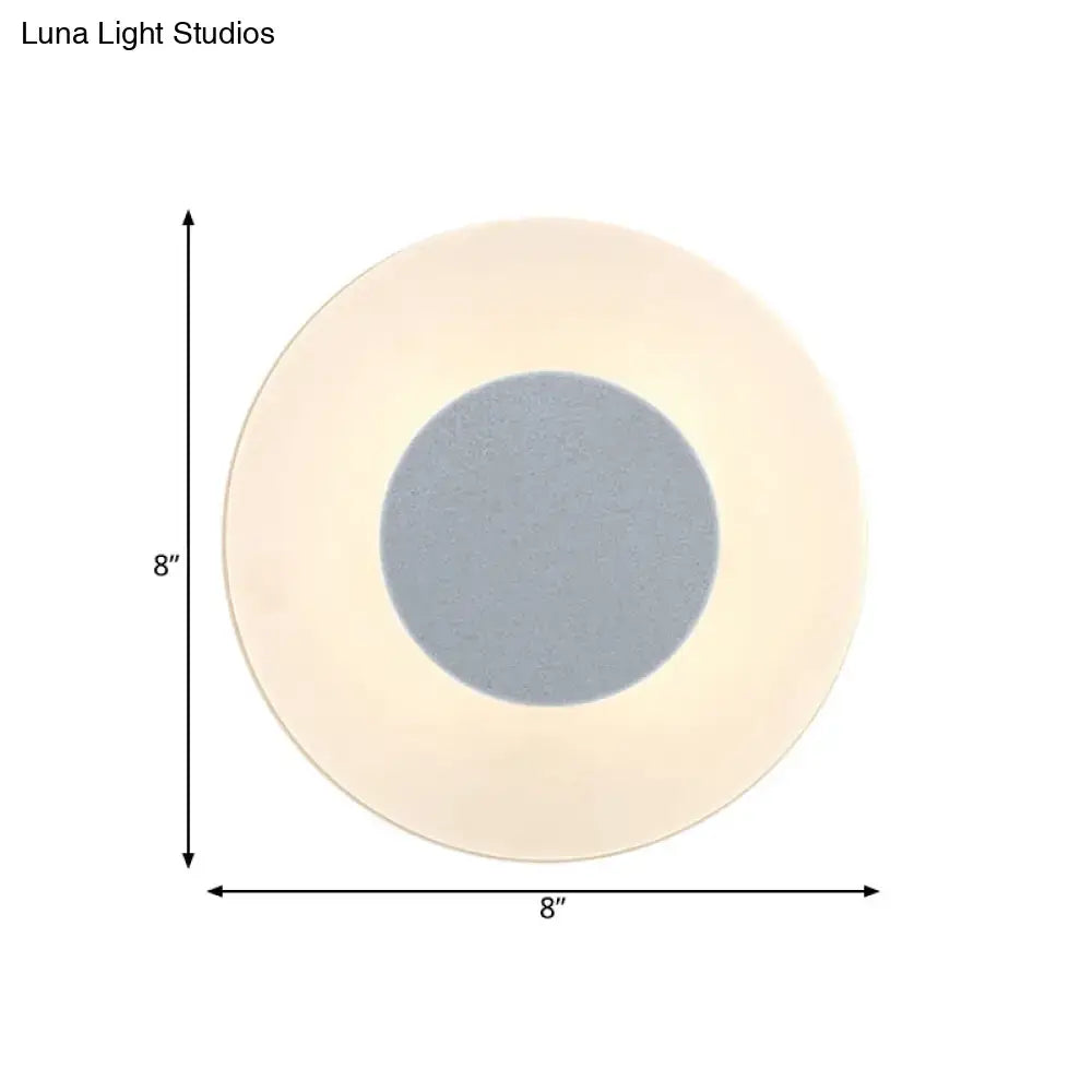 Minimalist circular led wall lamp with soft beige outer ring and gray center panel by luna light studios for living room
