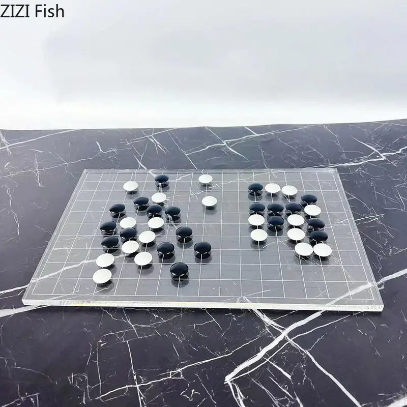 Clear acrylic go board with black and white stones as a minimalist decorbites geometric chess set for living room decor