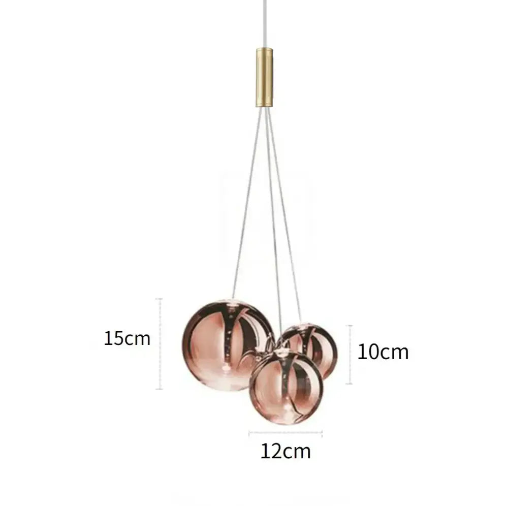 Modern copper-toned glass bubble led pendant light with brass finish for minimalist dining room decorbites glass bubble design