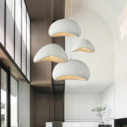 Modern white ceramic decorbites cobblestone pendant lights with textured dome design and warm interior glow for dining room decor