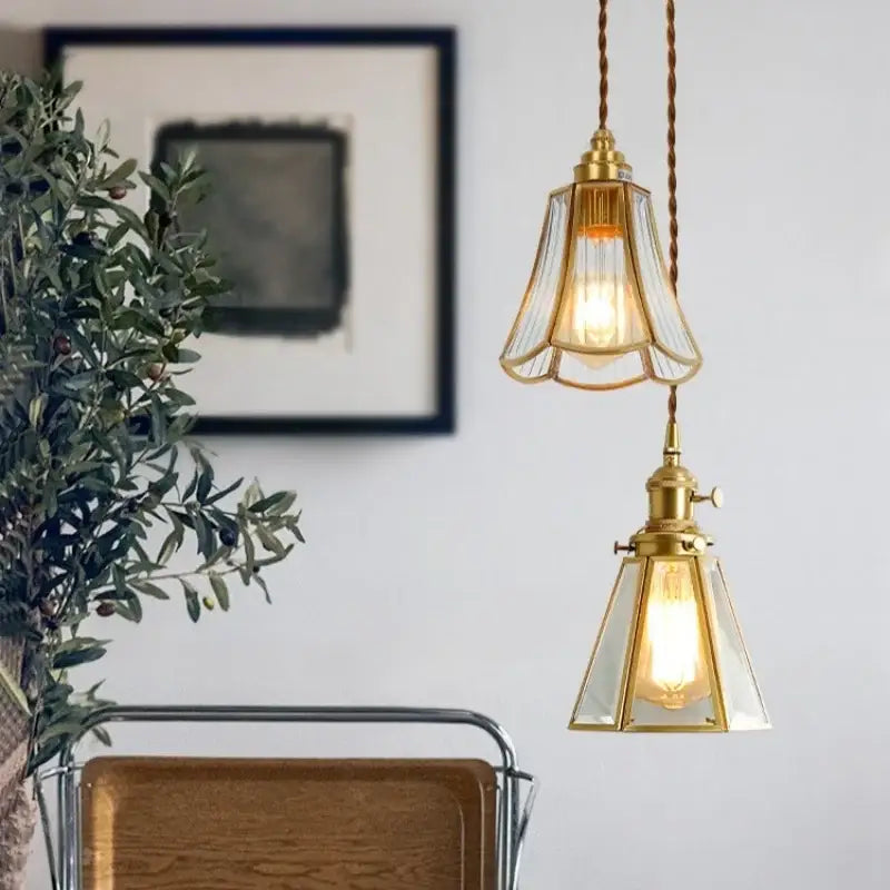 Minimalist copper glass led hanging pendant light with two brass-finished clear glass shades in fluted and geometric designs
