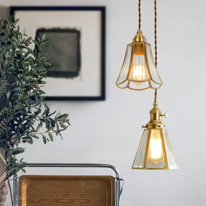 Minimalist copper glass led hanging pendant light with two brass-finished clear glass shades in fluted and geometric designs