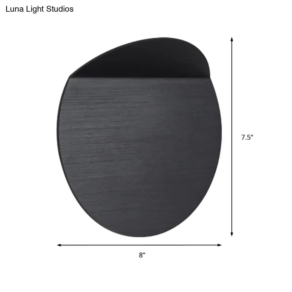 Minimalist black matte wall mount sconce light with brushed metal texture and led bulb for bedroom use