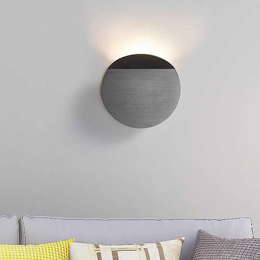 Minimalist copper wall mount sconce light with a brushed metallic finish and an led bulb for bedroom use