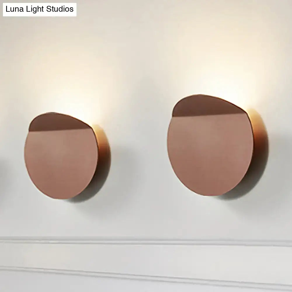 Minimalist copper sconce light with circular wall mount and led bulb featuring a sleek, minimalist design