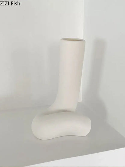 Cream-colored ceramic human body vase with sleek minimalist abstract boot design for bedroom decorbites abstract human decor