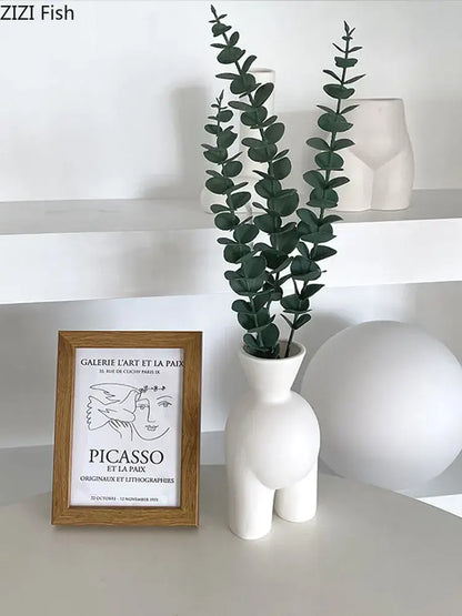 Minimalist cream ceramic abstract human body vase with sculptural hourglass shape and two short legs for bedroom decorbites decor