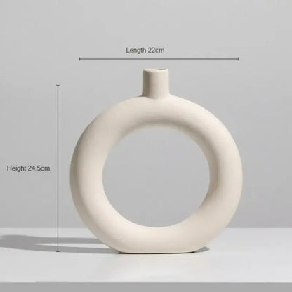 Minimalist cream ceramic art vase with a ring design and slender neck for decorbites ceramic art living room decor