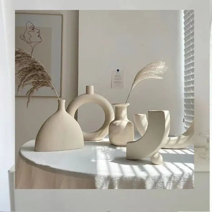 Minimalist cream ceramic art vase with abstract shapes for living room sculptural decor by decorbites ceramic art