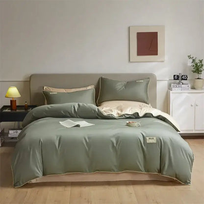 Minimalist cream and green egyptian cotton solid bedding set with sage green duvet cover and cream-colored piping