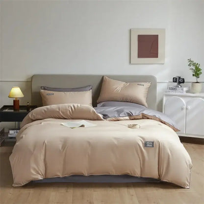 Beige and gray two-tone satin duvet cover set with subtle woven label in minimalist cream and green egyptian cotton solid bedding set