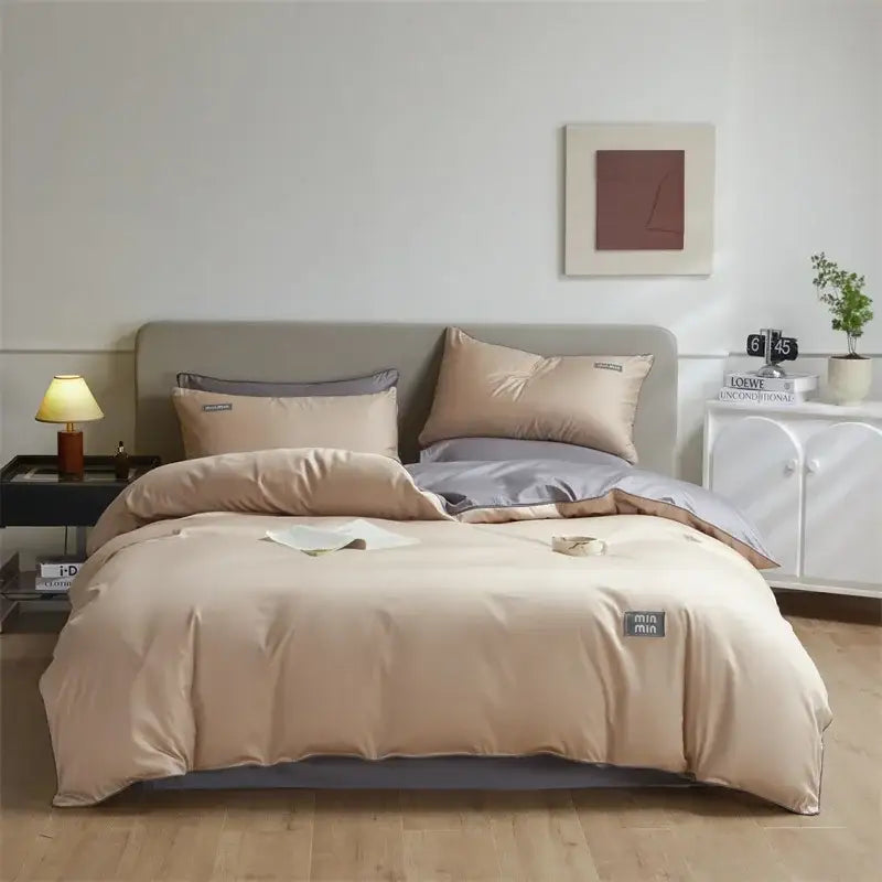 Beige and gray two-tone satin duvet cover set with subtle woven label in minimalist cream and green egyptian cotton solid bedding set