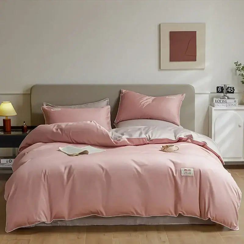 Pink satin duvet cover set with matching pillowcases featuring a subtle sheen and soft texture in egyptian cotton solid bedding set