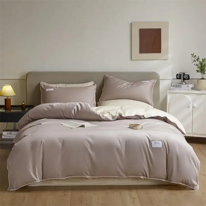 Beige satin duvet cover set with matching pillowcases and white trim in a minimalist cream and green egyptian cotton solid bedding set