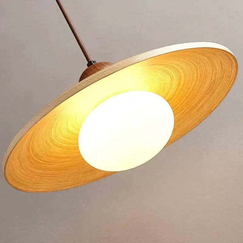 Warm-toned wooden disc pendant chandelier with frosted glass center for minimalist cream Japanese style dining room decorbites cream Japanese