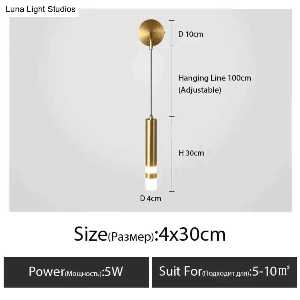A minimalist creative luxury brass pendant light with cylindrical design and adjustable line for luxury bedroom bedside