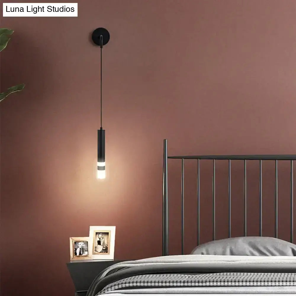 Minimalist creative luxury black cylindrical pendant wall lamp with sleek modern design for luxury bedroom bedside use