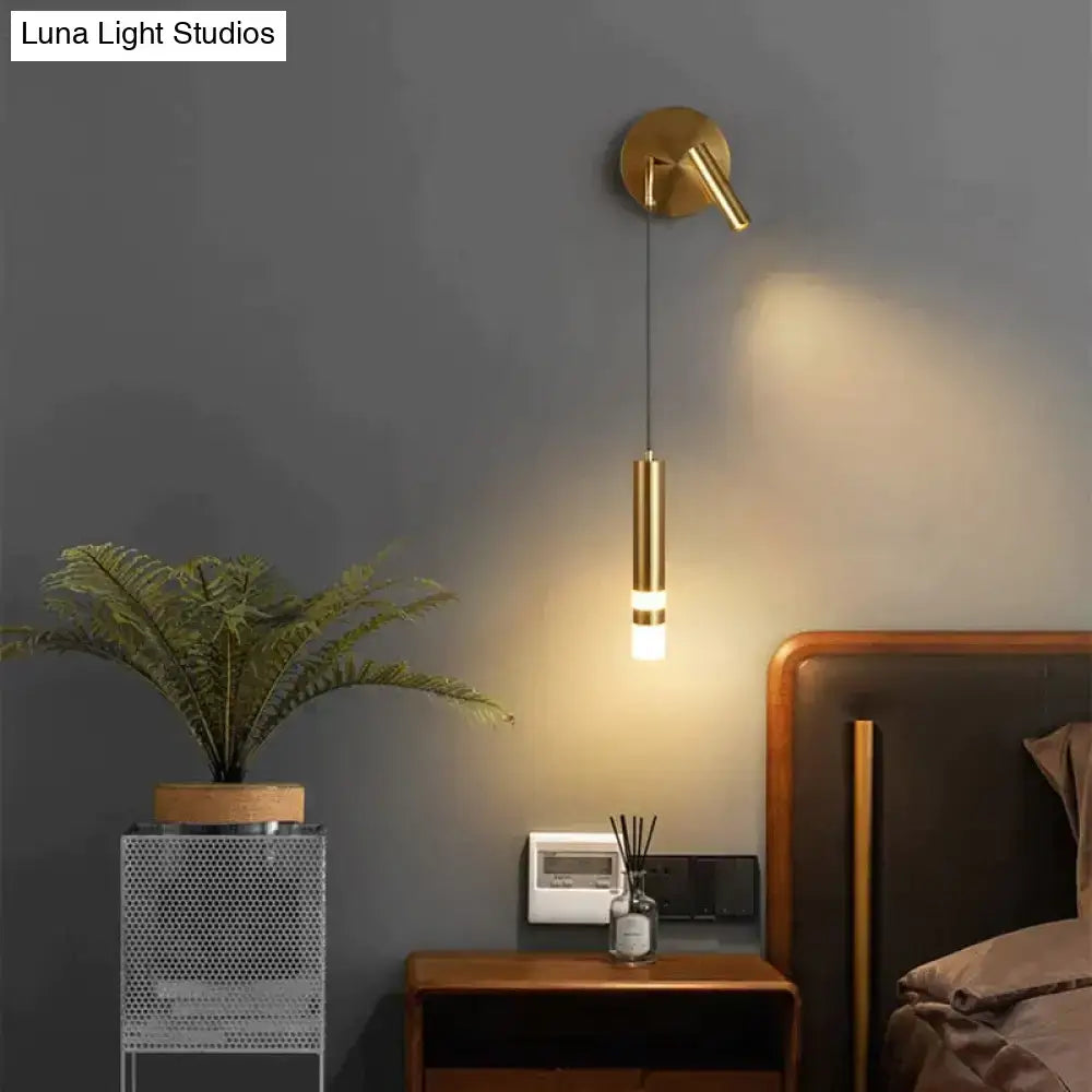 Gold-toned cylindrical wall sconce with adjustable arm for minimalist creative luxury bedroom bedside lighting