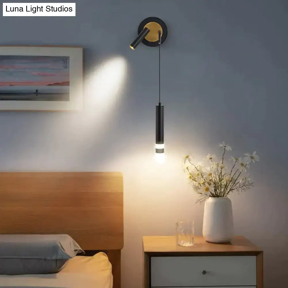 Minimalist creative luxury black cylindrical pendant bedside wall lamp with gold-toned adjustable spotlight for bedroom