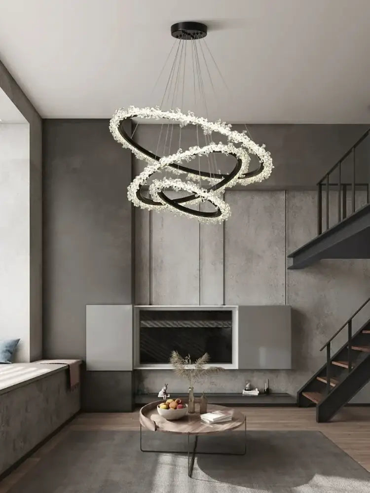 Minimalist crystal gold black ring chandelier with spiral black metal rings and white crystal accents for dining room decorbites