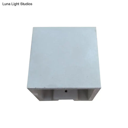 Light gray cube cuboid cement flush mount wall light with hollow center and small hole for stairs lighting