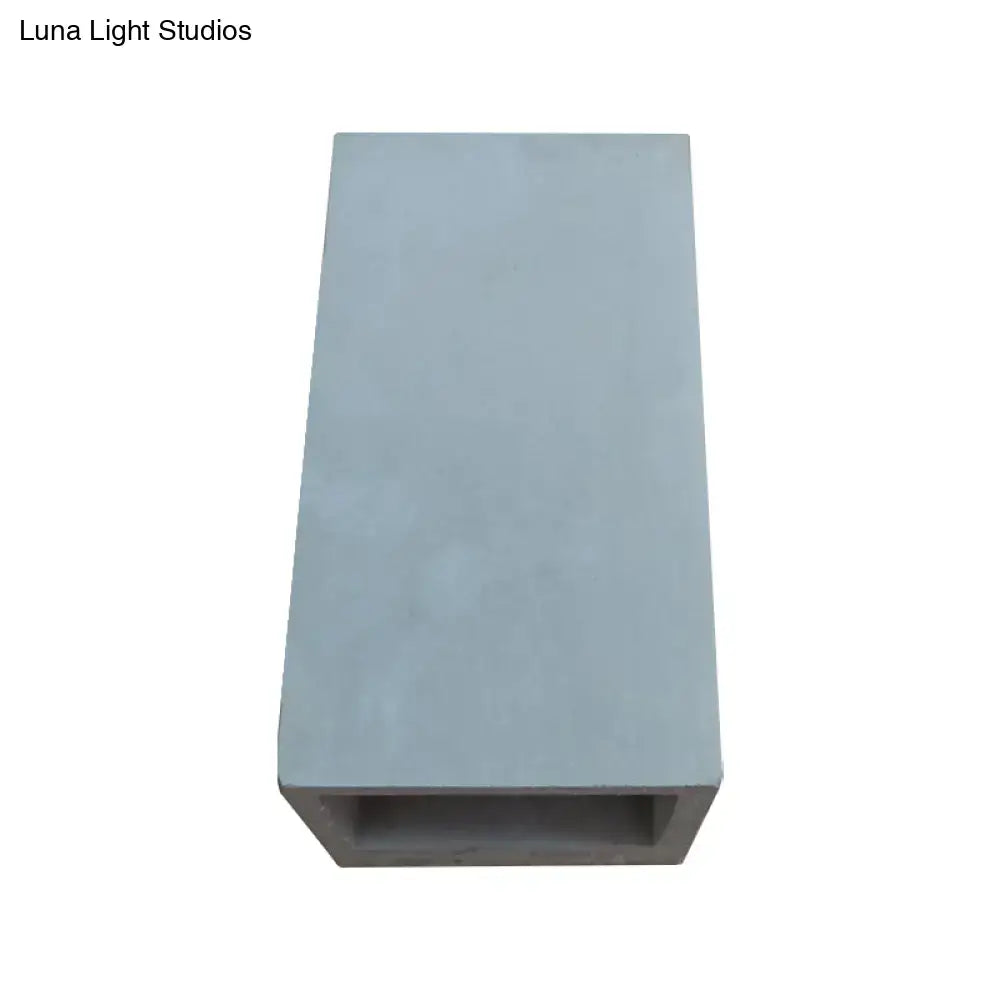 Light gray cube cuboid cement flush mount wall planter with hollow center for minimalist stairs mount wall light design