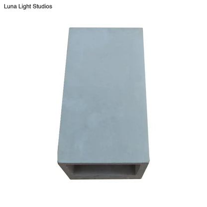 Light gray cube cuboid cement flush mount wall planter with hollow center for minimalist stairs mount wall light design