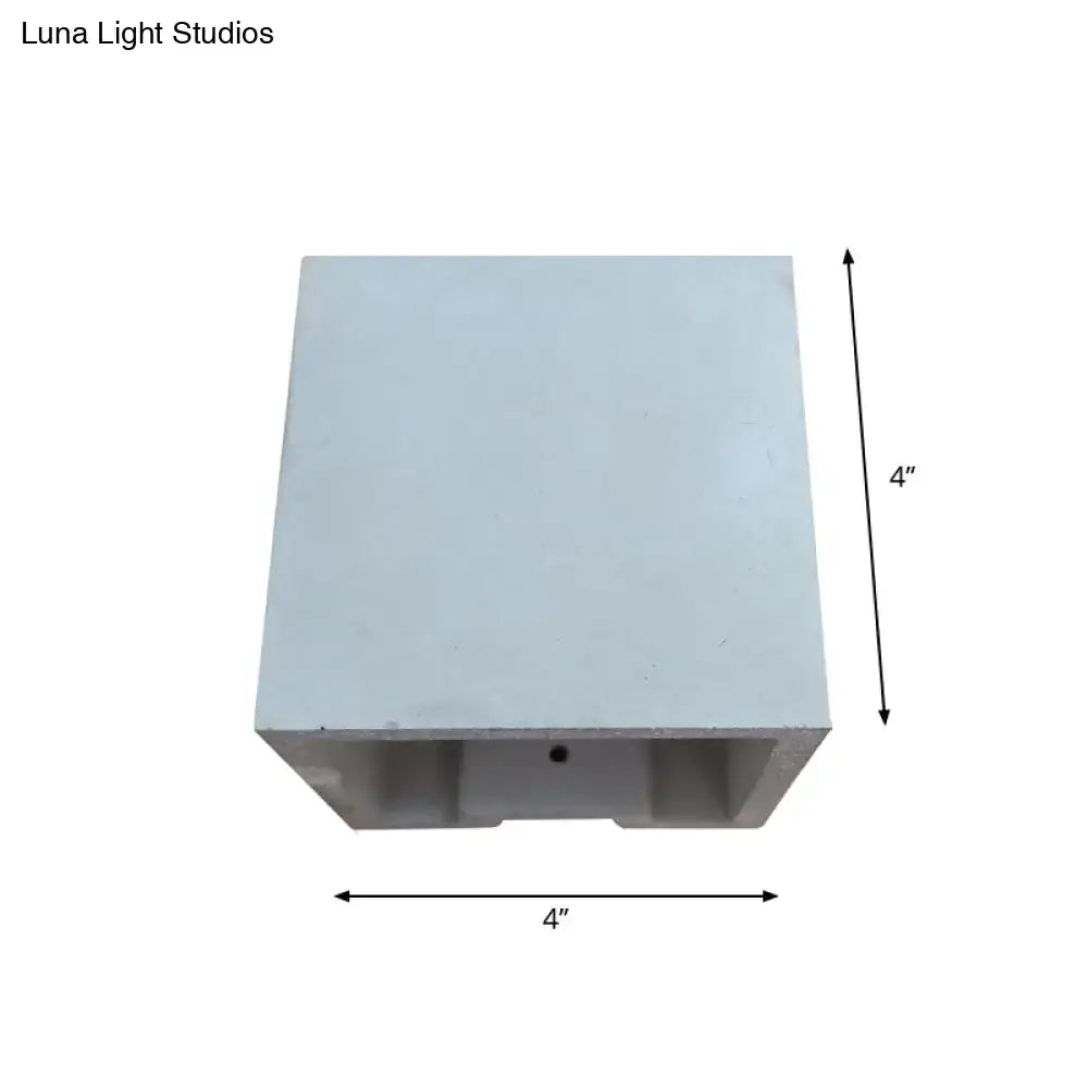 A sleek 4-inch square white cube cuboid cement flush mount wall light with minimalist design and subtle texture for stairs