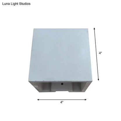 A sleek 4-inch square white cube cuboid cement flush mount wall light with minimalist design and subtle texture for stairs