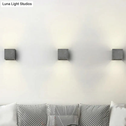 Three sleek matte gray cube cuboid cement flush mount wall light sconces for stairs with minimalist design