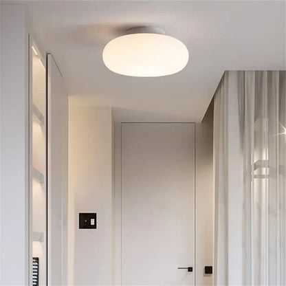 Minimalist frosted white glass pendant lamp with soft white diffuser and sleek round design for dining table decorbites itka pendant