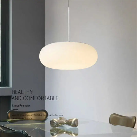 Minimalist frosted white glass pendant lamp with oval shade and metallic stem for dining table by decorbites itka pendant